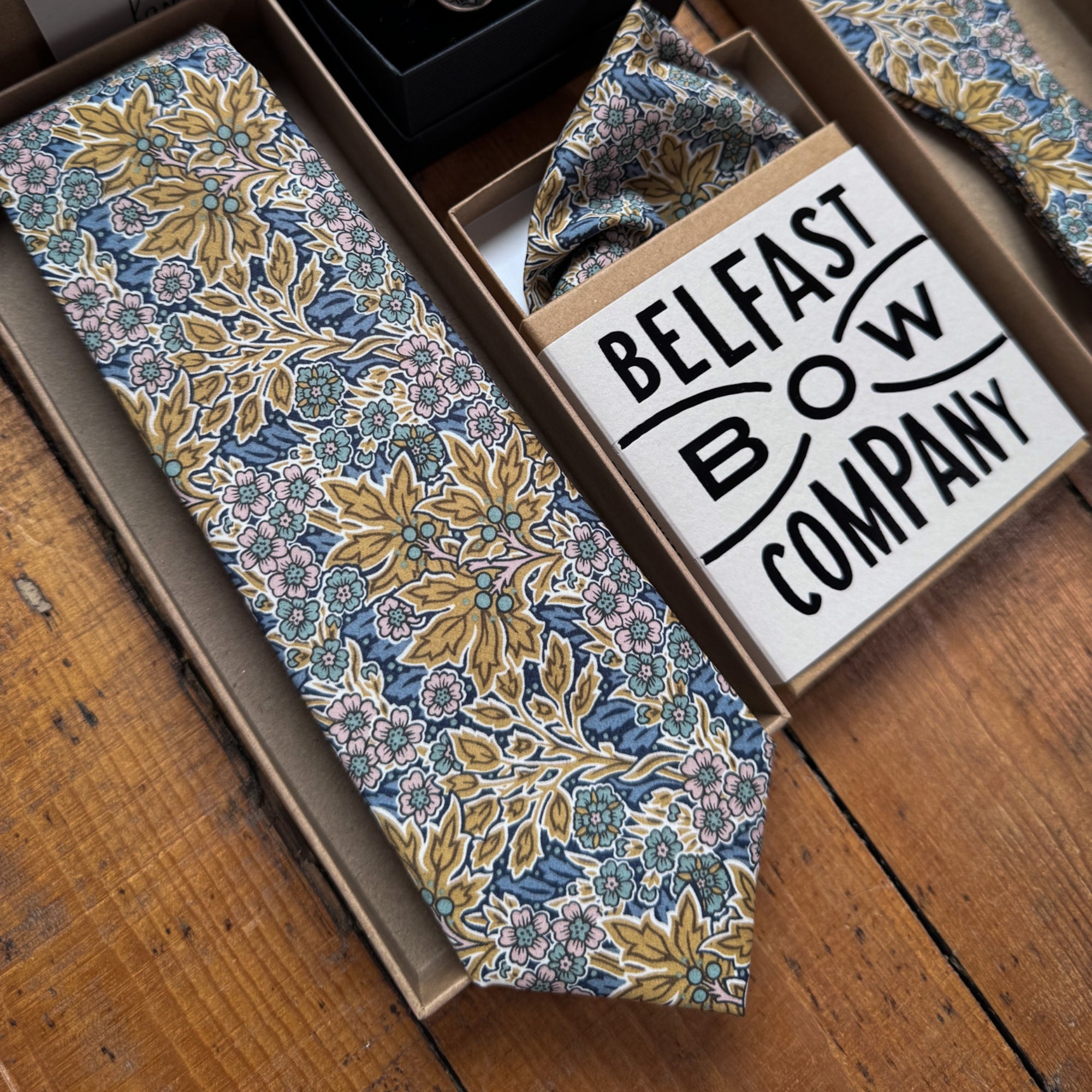 Blue and yellow floral wedding accessories for the grooms party by the belfast bow company