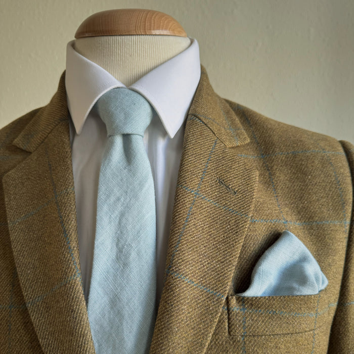 Matching linen pocket square and tie in duck egg blue by the belfast bow company