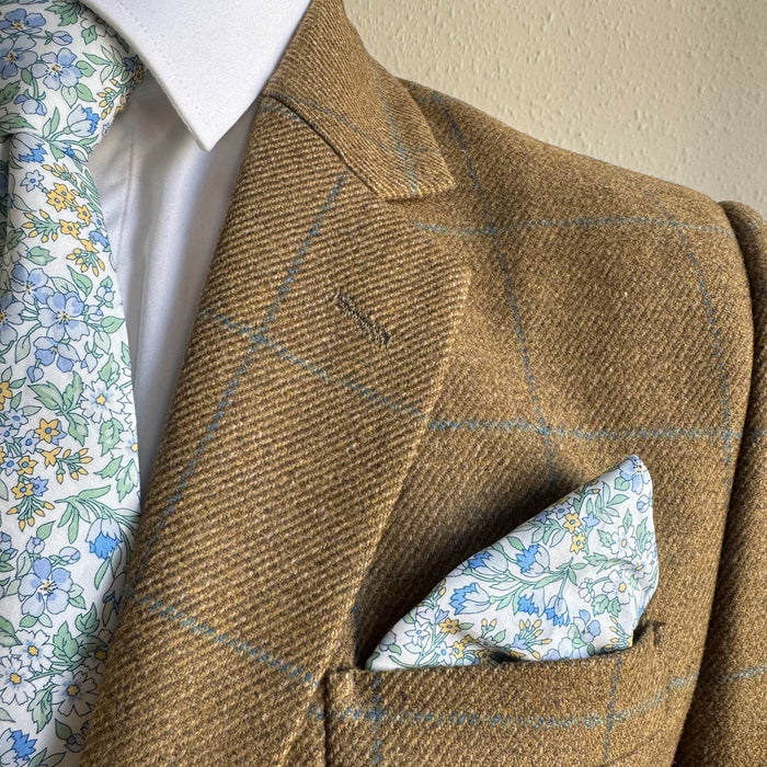 Matching pocket square and tie in pale blue floral by the belfast bow company
