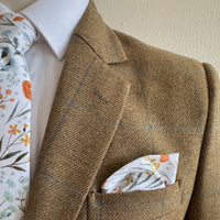 Matching tie and pocket square in spring floral by the belfast bow company