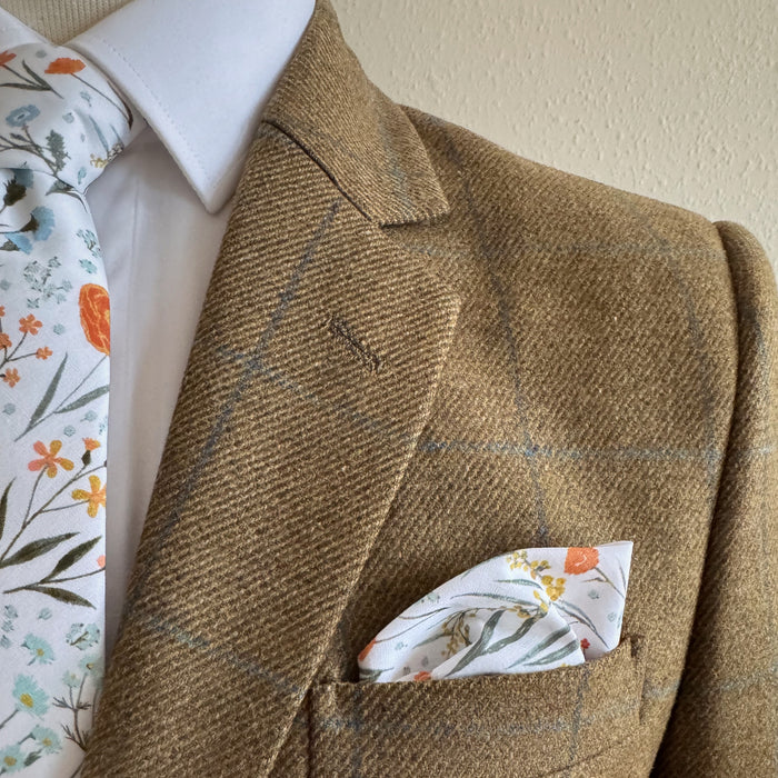 Matching tie and pocket square in spring floral by the belfast bow company