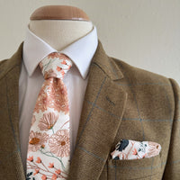 orange and green floral matching tie and pocket square by the belfast bow company