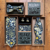 Groomsmen gift set with floral ties, bow tie, and cufflinks from Belfast Bow Company