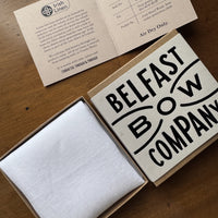White irish linen pocket square folded in a belfast bow company branded gift box