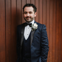 Groom wearing black silk bow tie by the belfast bow company