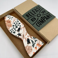 orange and green floral self-tie bow tie by the belfast bow company