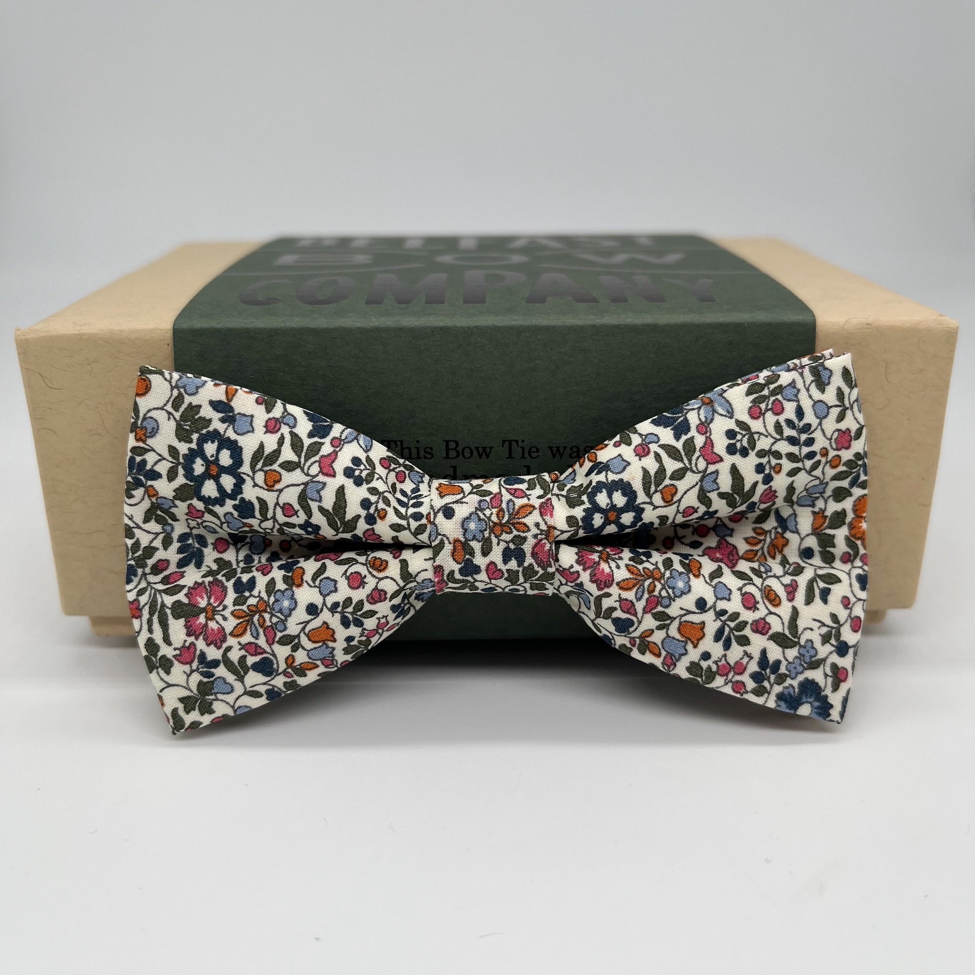 Boys dicky bow tie in burnt orange floral by the belfast bow company